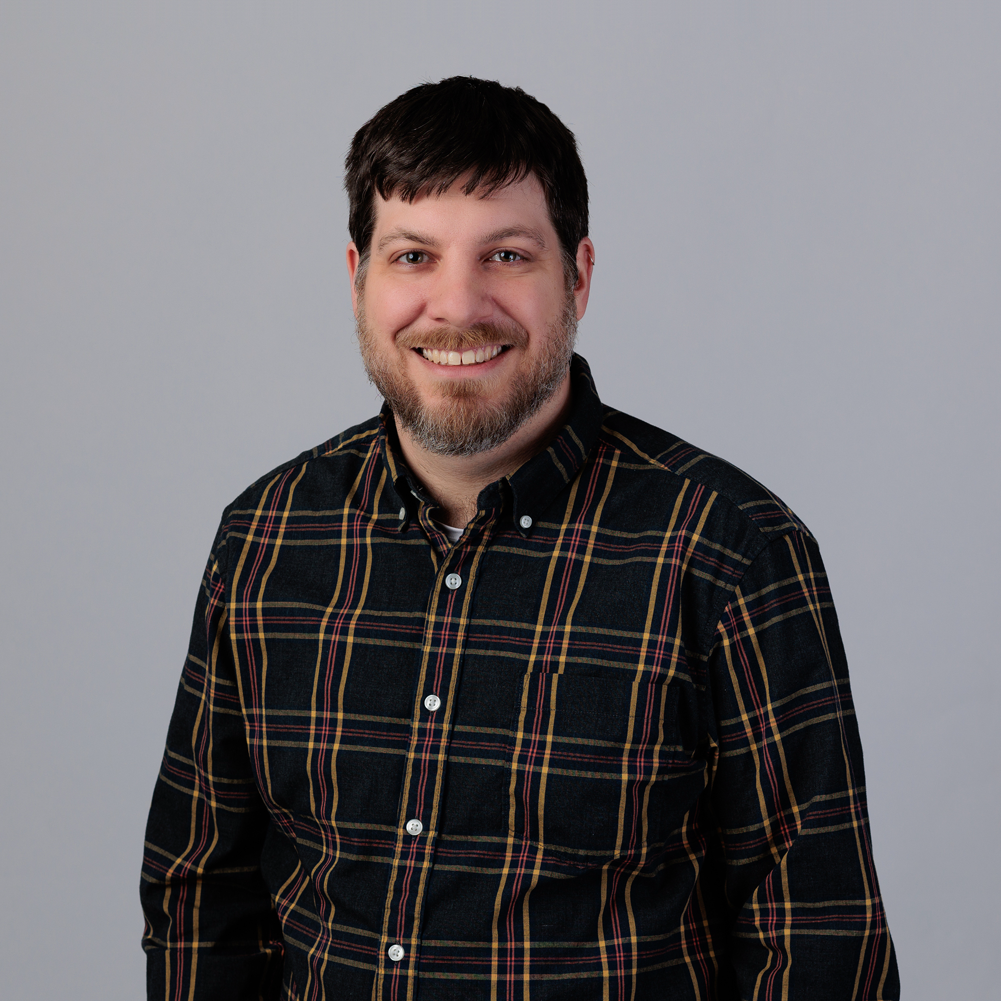 Headshot of Greg Carlson